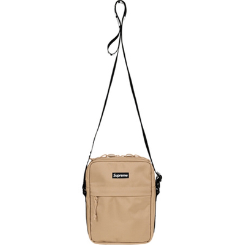A brown one-shoulder bag full of bouquets